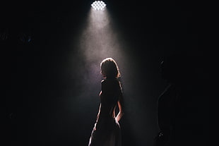 woman standing under the light HD wallpaper