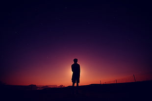 silhouette photo of person standing