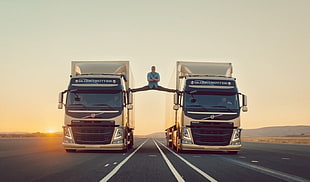 two brown freight trucks, Jean-Claude Van Damme, actor, commercial, trucks
