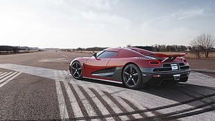 red and black sports coupe on concrete road at daytime HD wallpaper