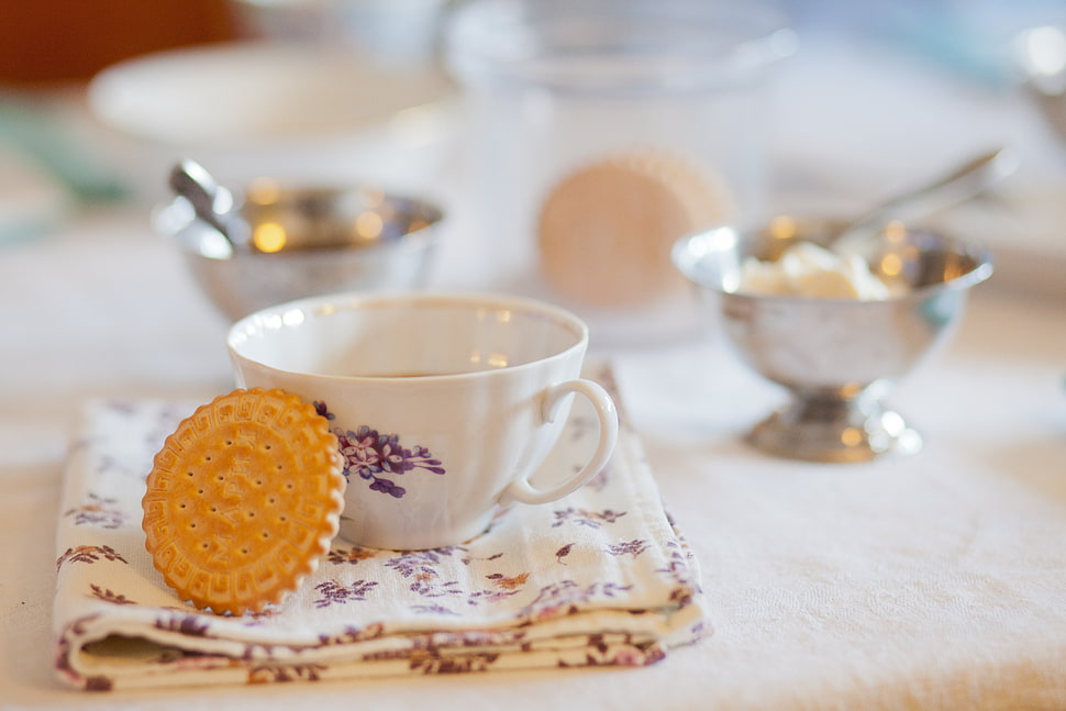 white ceramic cup with cookie on white table placemat HD wallpaper