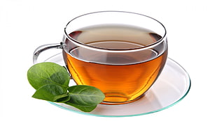 clear glass teacup with tea