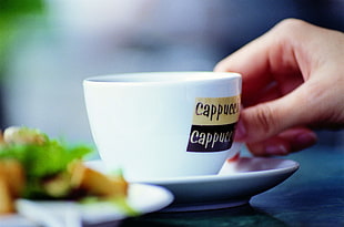 tilt lens photography of capuccino cup