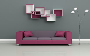 pink and gray 3-seat sofa with two throw pillows