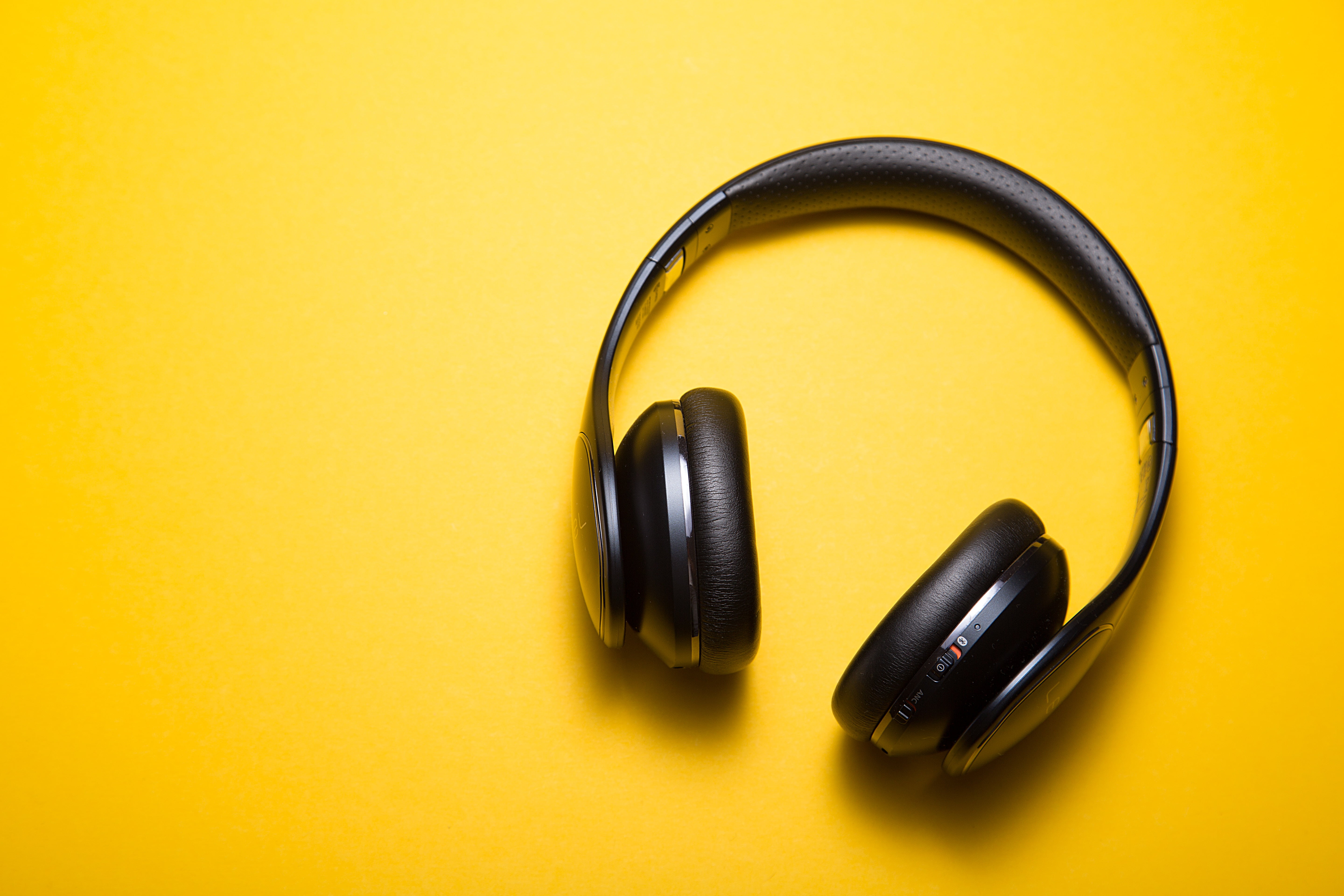 Black wireless headphones, Headphones, Yellow background