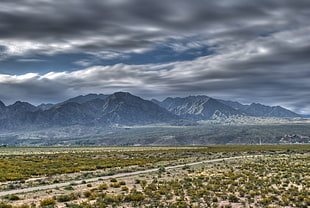 mountain range under cloudy sky during daytime, una