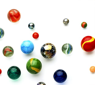 marble toy collection on white surface HD wallpaper