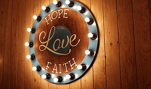 round wall decor with lamp and hope love faith-printed wall art