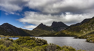 green and black mountains over blue sky, cradle mountain, tasmania