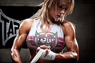 woman wearing white and red Tapout crop top
