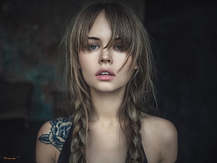 topless woman with braided hair