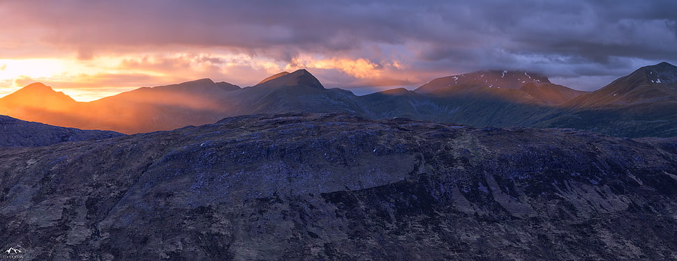 aerial view of gray mountain under sunset HD wallpaper