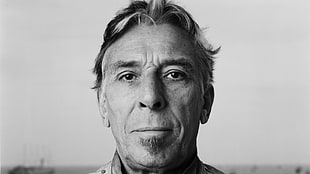 man's gray scale portrait photo