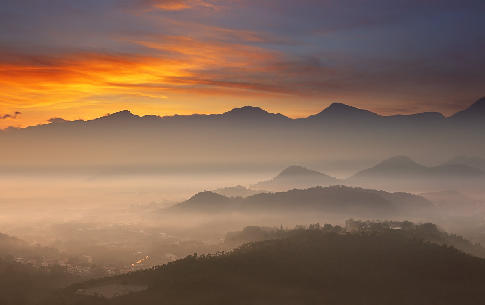 Photo Of Brown Rocky Mountains Covered With Fog During Golden Hour Hd