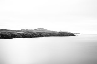 grayscale landscape photo of lake, welsh