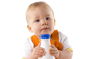 baby holding a bottle