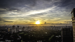 Aerial photography of city near body of water during golden hour, manila