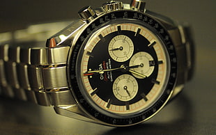 round silver-faced chronograph watch