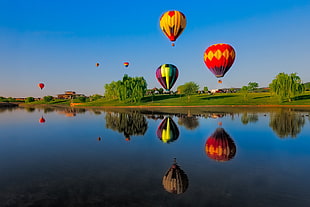 assorted hot air balloons ballooning during daytime