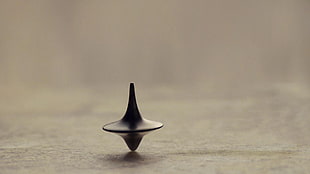 black spinning top toy, Inception, time, totem