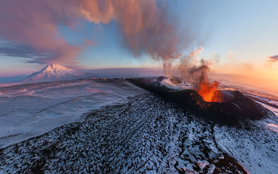 volcano erupting during golden hour HD wallpaper