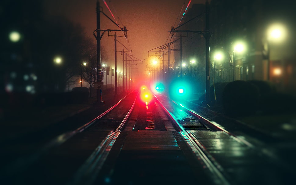 black train rails, blurred, railway, night, lights HD wallpaper