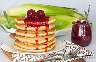 pancake with strawberry jam on top on white ceramic plater HD wallpaper
