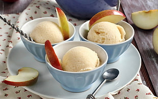 three ice cream with apple served on blue cups, ice cream