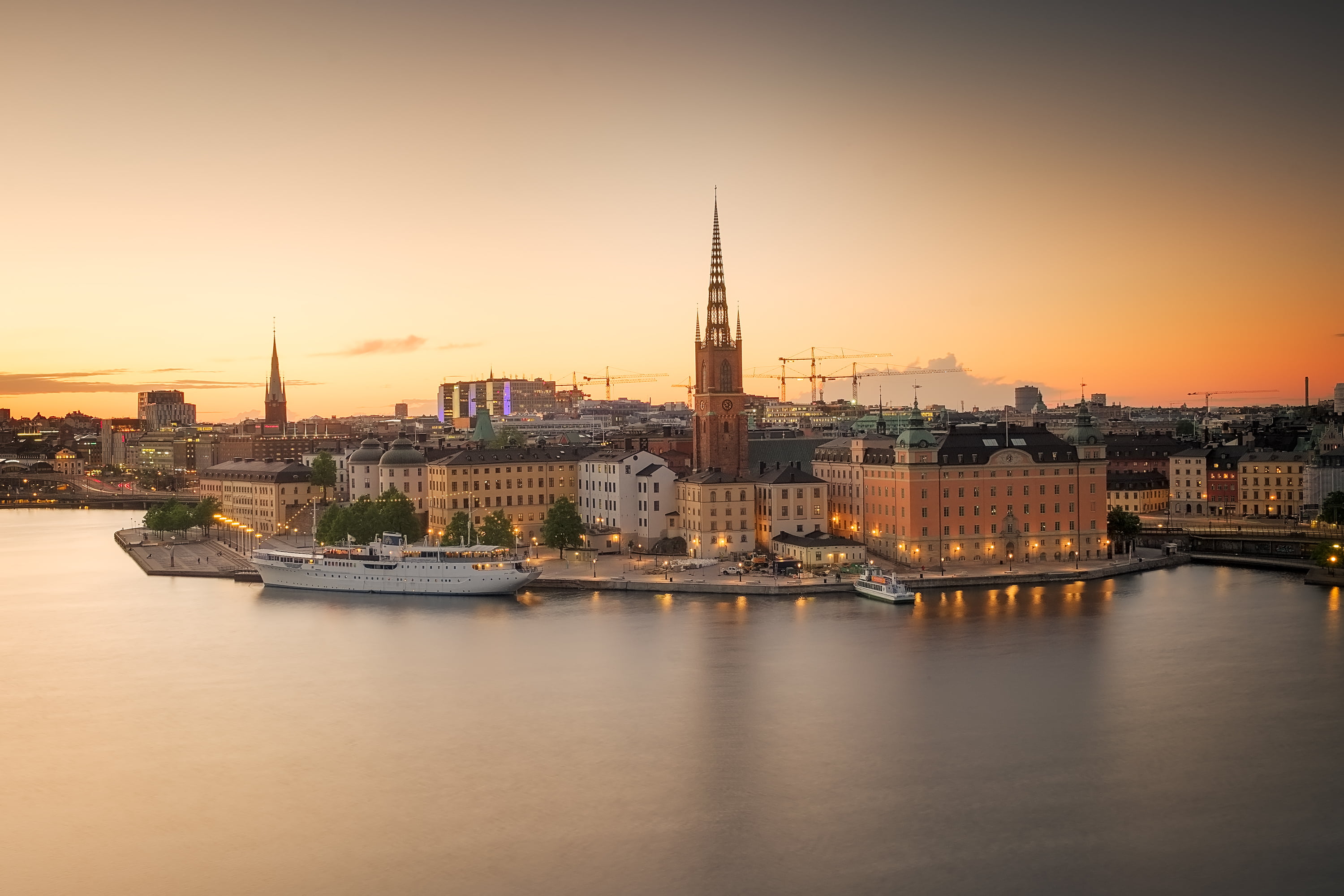 brown and white high rise building photo, stockholm