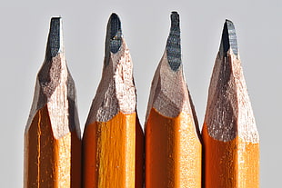 four brown lead pencil tips