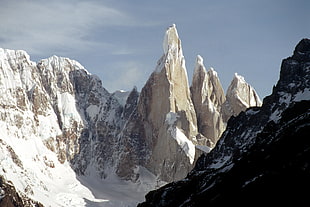 brown mountain cover by snow under the clear sky during daytime, argentina