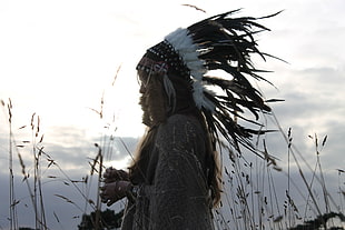 woman wearing native American headpiece