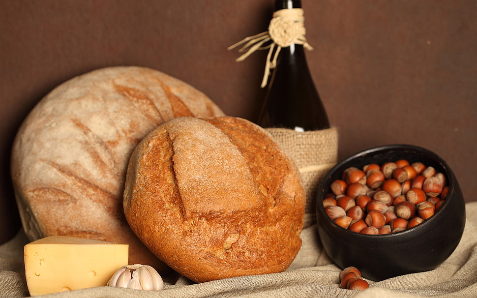 bread and wine bottle on table HD wallpaper