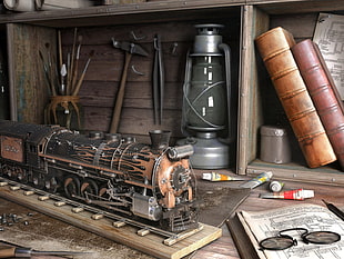 black and brown train miniature near grey kerosene lamp