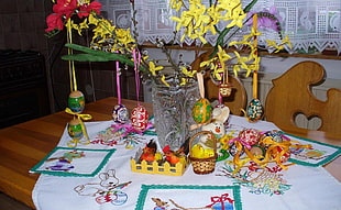 brown wicker basket miniature beside clear glass vase on brown wooden table