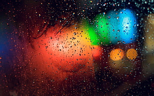 photography of raindrops on glass