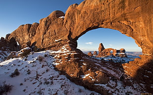brown rock formation, landscape, rock formation, arch, snow HD wallpaper