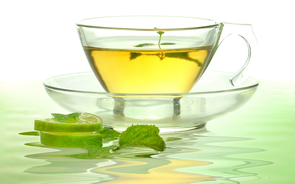 clear glass yellow liquid filled teacup HD wallpaper