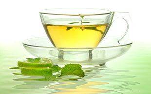 clear glass yellow liquid filled teacup HD wallpaper