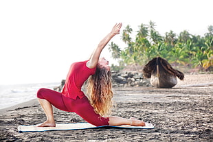 woman in red clothes doing yoga meditation HD wallpaper