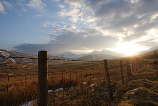 black iron wire fence under sunlight, snowdonian