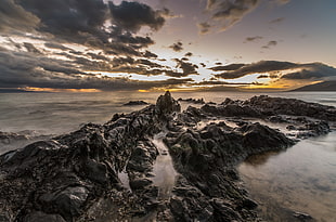 panoramic view of rocks beside the sea water HD wallpaper