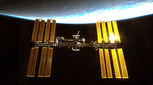 black and gold-colored space satellite, International Space Station