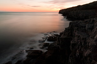 landscape photography of mountain cliff near body of water, dorset