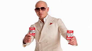 Pitbull holding two labeled boxes