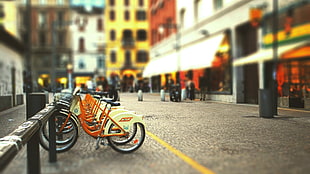 orange and white city bicycle, cityscape, street