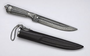 gray handled knife with sheath