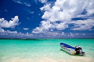 white and blue speedboat on ocean under white and blue sky during daytime, punta cana, dominican republic HD wallpaper