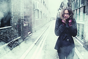photography of woman wearing black coat during winter