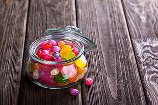 clear glass candy dispenser with candies HD wallpaper